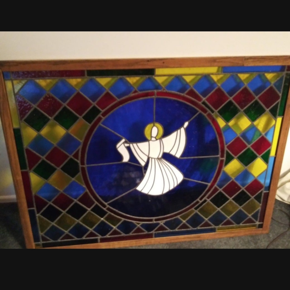 Huge stained glass angel with wooden frame